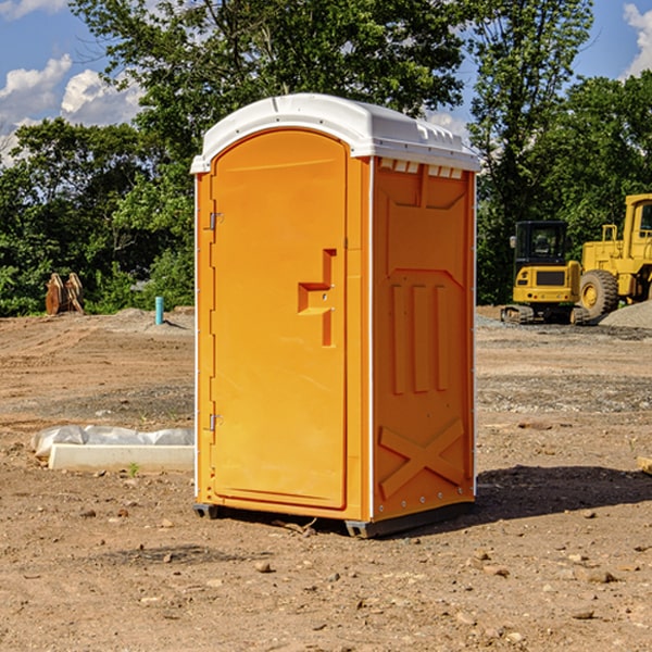 what is the cost difference between standard and deluxe porta potty rentals in Bentonville